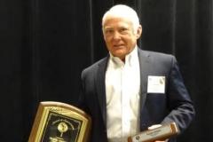 Frank with plaque and gift